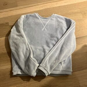 A blue fuzzy sweatshirt.